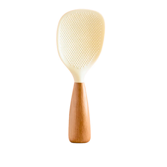White rice paddle with wooden handle on a white background